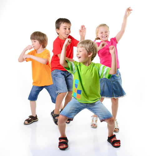 Colourfully dressed kids dancing and having fun to music. 